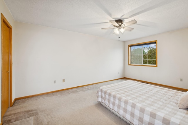 13210 Meadowood Trl NW Unit 63Nw, Coon Rapids, MN 55448 - bedroom with carpet, a textured ceiling, and ceiling fan