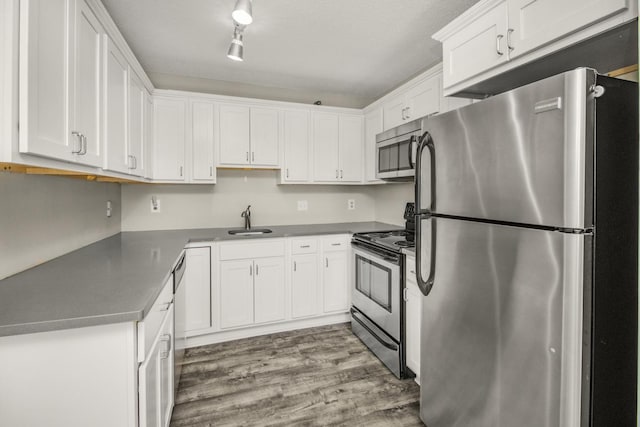 26 10th St W Unit 1701, Saint Paul, MN 55102 - kitchen featuring stainless steel appliances, a sink, white cabinets, and wood finished floors