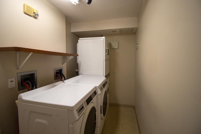26 10th St W Unit 1701, Saint Paul, MN 55102 - communal laundry room with separate washer and dryer, stacked washer / drying machine, baseboards, and a textured ceiling