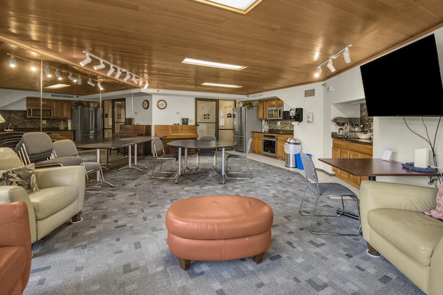 26 10th St W Unit 1701, Saint Paul, MN 55102 - living room with track lighting, wooden ceiling, and carpet
