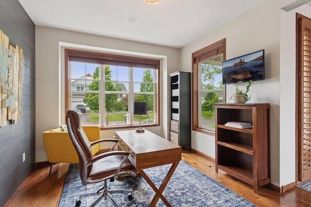 11200 Walnut Ln, Woodbury, MN 55129 - office area featuring hardwood / wood-style flooring and baseboards