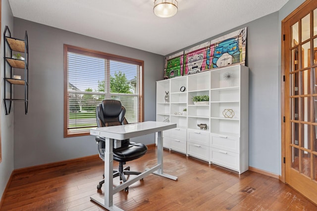 11200 Walnut Ln, Woodbury, MN 55129 - office featuring hardwood / wood-style floors and baseboards