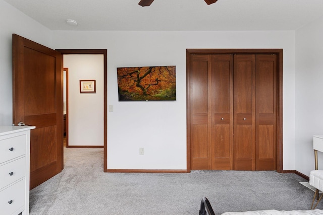 11200 Walnut Ln, Woodbury, MN 55129 - unfurnished bedroom with light colored carpet, a closet, baseboards, and a ceiling fan