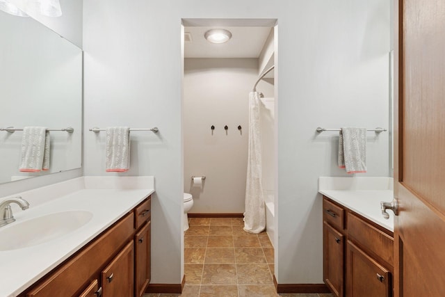 11200 Walnut Ln, Woodbury, MN 55129 - bathroom with vanity, toilet, shower / bath combo, and baseboards