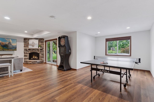 11200 Walnut Ln, Woodbury, MN 55129 - recreation room with wood finished floors, baseboards, recessed lighting, and a fireplace