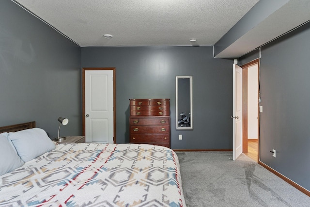 11200 Walnut Ln, Woodbury, MN 55129 - carpeted bedroom with a textured ceiling and baseboards