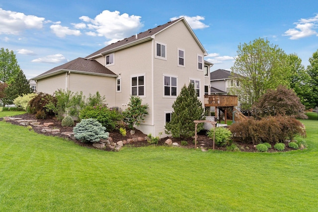 11200 Walnut Ln, Woodbury, MN 55129 - back of property featuring a lawn and a wooden deck