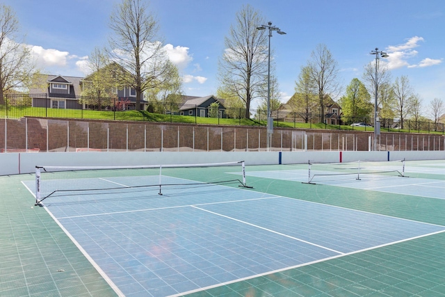 11200 Walnut Ln, Woodbury, MN 55129 - view of tennis court with community basketball court and a residential view