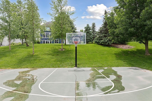 11200 Walnut Ln, Woodbury, MN 55129 - view of basketball court featuring basketball hoop and a yard