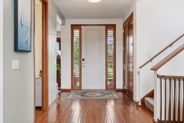 11200 Walnut Ln, Woodbury, MN 55129 - foyer entrance with stairs, hardwood / wood-style floors, and baseboards