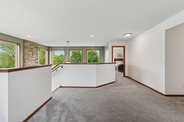 11200 Walnut Ln, Woodbury, MN 55129 - unfurnished room featuring light colored carpet, baseboards, and recessed lighting