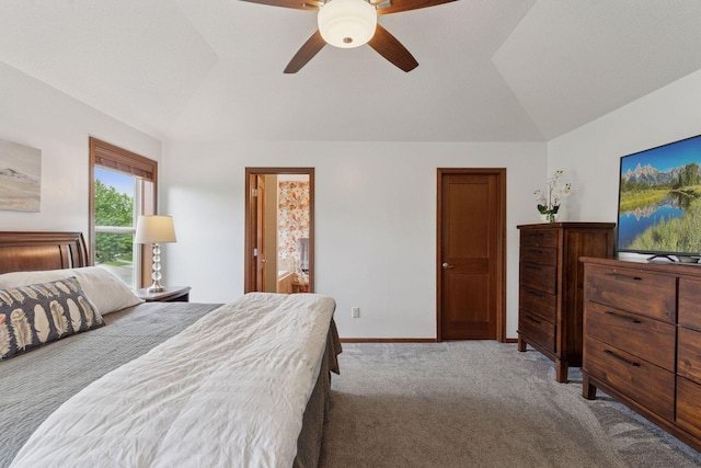 11200 Walnut Ln, Woodbury, MN 55129 - carpeted bedroom featuring vaulted ceiling, baseboards, ceiling fan, and ensuite bath