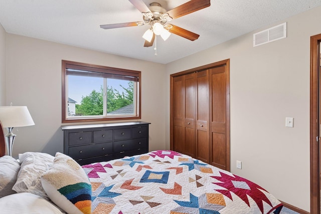 11200 Walnut Ln, Woodbury, MN 55129 - carpeted bedroom with a closet and a ceiling fan