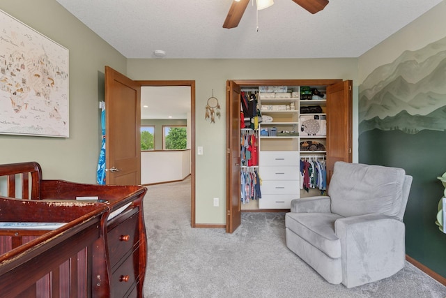 11200 Walnut Ln, Woodbury, MN 55129 - bedroom featuring a closet, light carpet, a ceiling fan, and baseboards