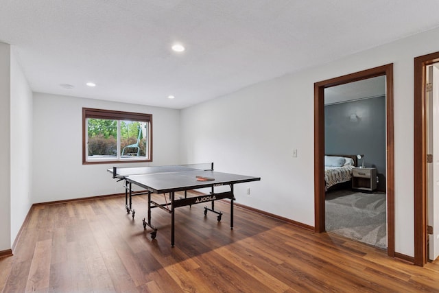 11200 Walnut Ln, Woodbury, MN 55129 - game room featuring wood finished floors, baseboards, and recessed lighting