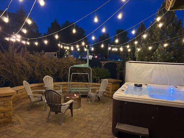 11200 Walnut Ln, Woodbury, MN 55129 - patio at twilight with a hot tub, a fire pit, and a patio