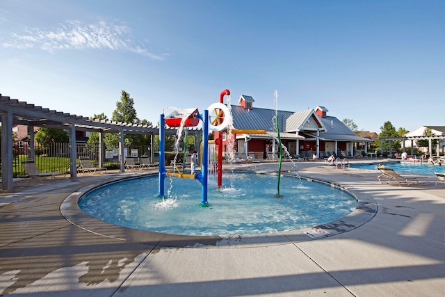 11200 Walnut Ln, Woodbury, MN 55129 - community pool with a water play area and a patio