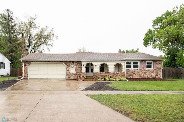 201 4th Ave E, West Fargo, ND 58078 - ranch-style home with a garage, brick siding, and concrete driveway