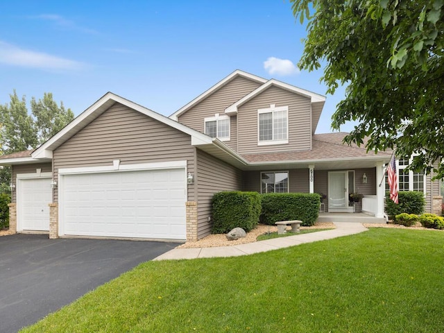 6700 210th Lane Cir N, Forest Lake, MN 55025 - view of front of property featuring a garage, driveway, a front lawn, and a shingled roof