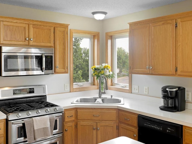6700 210th Lane Cir N, Forest Lake, MN 55025 - kitchen with stainless steel appliances, light countertops, and a textured ceiling