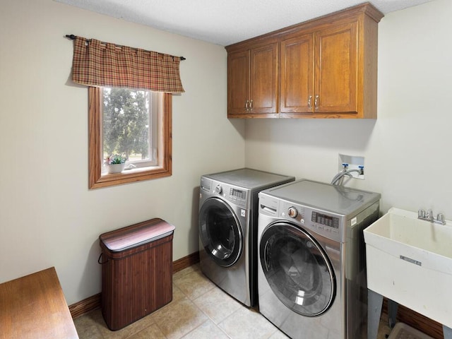 6700 210th Lane Cir N, Forest Lake, MN 55025 - washroom featuring cabinet space, washer and clothes dryer, and light tile patterned floors