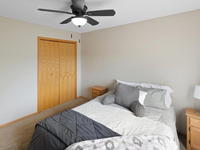 6700 210th Lane Cir N, Forest Lake, MN 55025 - carpeted bedroom featuring a closet and a ceiling fan