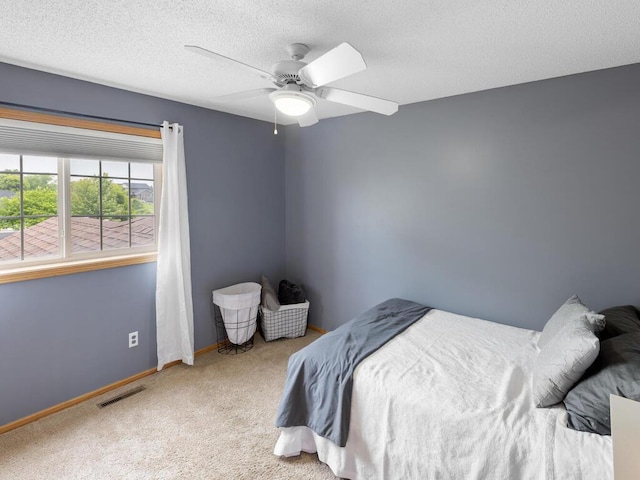 6700 210th Lane Cir N, Forest Lake, MN 55025 - carpeted bedroom featuring a ceiling fan and a textured ceiling