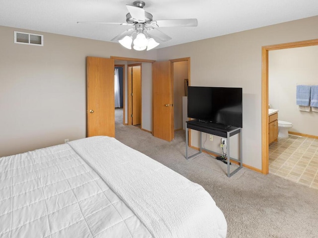 6700 210th Lane Cir N, Forest Lake, MN 55025 - bedroom with light colored carpet, ensuite bathroom, and ceiling fan