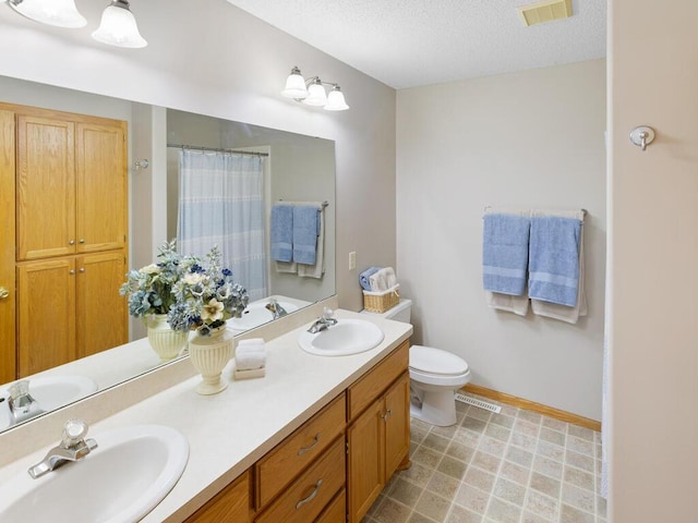 6700 210th Lane Cir N, Forest Lake, MN 55025 - bathroom with double vanity, a textured ceiling, and a shower with shower curtain