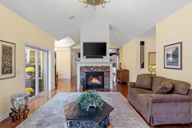 24064 Rivers Edge Rd, Rogers, MN 55374 - living area featuring a fireplace, wood finished floors, baseboards, and high vaulted ceiling