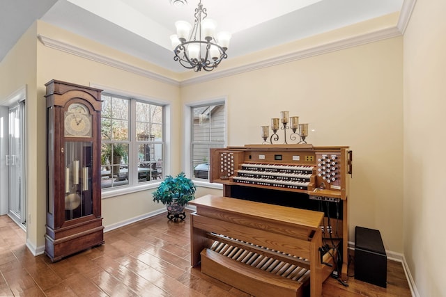 24064 Rivers Edge Rd, Rogers, MN 55374 - home office with a chandelier, ornamental molding, wood finished floors, and baseboards