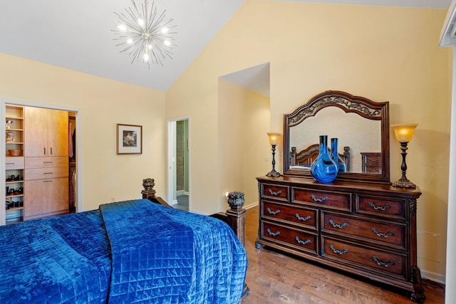 24064 Rivers Edge Rd, Rogers, MN 55374 - bedroom with a chandelier, wood finished floors, and high vaulted ceiling