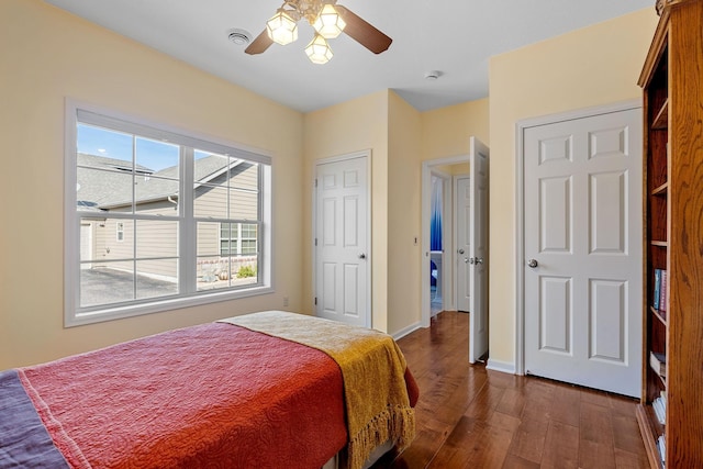 24064 Rivers Edge Rd, Rogers, MN 55374 - bedroom with dark wood finished floors, baseboards, and a ceiling fan