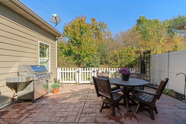 24064 Rivers Edge Rd, Rogers, MN 55374 - view of patio / terrace with grilling area, fence, and outdoor dining space