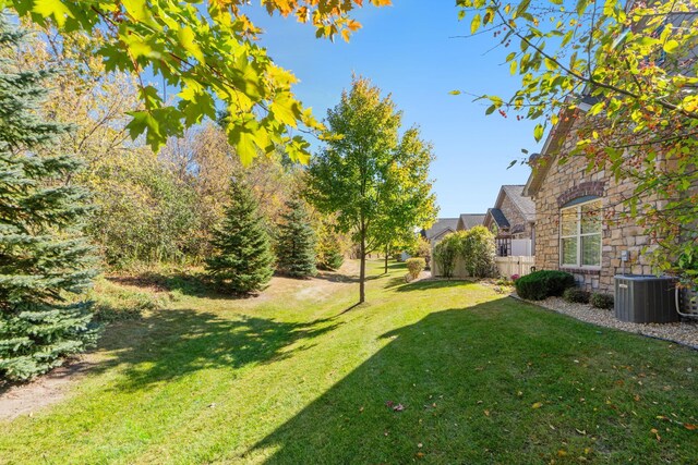 24064 Rivers Edge Rd, Rogers, MN 55374 - view of grassy yard featuring central air condition unit