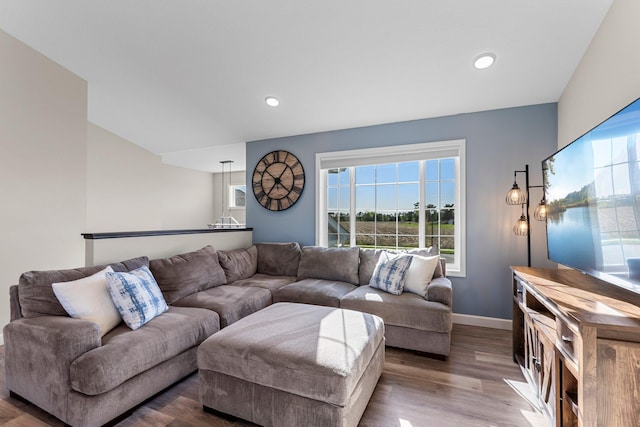 1120 7th Ave NE, Isanti, MN 55040 - living area with wood finished floors and recessed lighting
