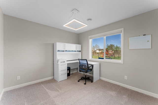 1120 7th Ave NE, Isanti, MN 55040 - office area featuring light carpet and baseboards