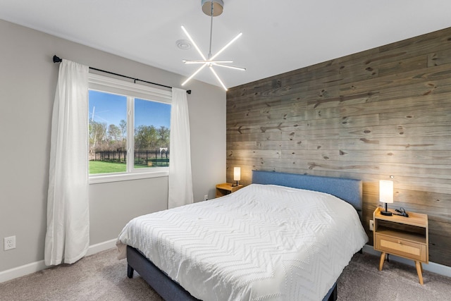 1120 7th Ave NE, Isanti, MN 55040 - carpeted bedroom with wooden walls and baseboards