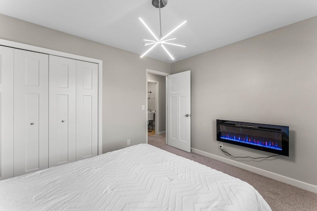 1120 7th Ave NE, Isanti, MN 55040 - bedroom with carpet floors, a glass covered fireplace, and a closet