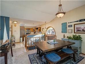 1555 Bluebird Ln, Mound, MN 55364 - dining area featuring lofted ceiling and a chandelier
