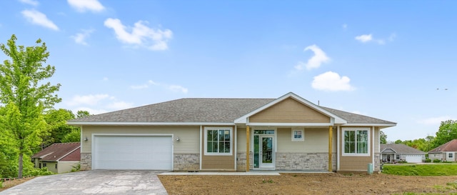 31079 Magnolia Ridge Way, Lindstrom, MN 55045 - view of front of home featuring a garage, driveway, and stone siding