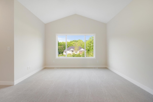 31079 Magnolia Ridge Way, Lindstrom, MN 55045 - empty room with light carpet, vaulted ceiling, and baseboards