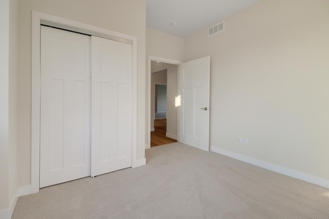 31079 Magnolia Ridge Way, Lindstrom, MN 55045 - unfurnished bedroom with light carpet, a closet, and baseboards
