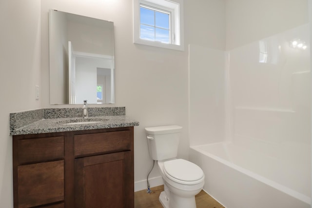 31079 Magnolia Ridge Way, Lindstrom, MN 55045 - bathroom featuring toilet, vanity, tub / shower combination, baseboards, and wood finished floors