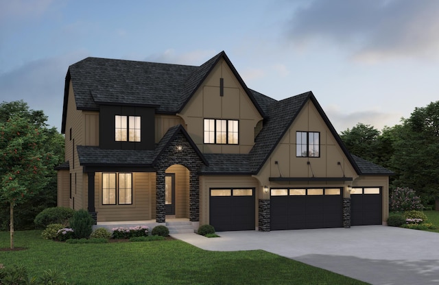 10320 Peony Ln N, Maple Grove, MN 55311 - view of front of property with stone siding, a front lawn, concrete driveway, board and batten siding, and roof with shingles