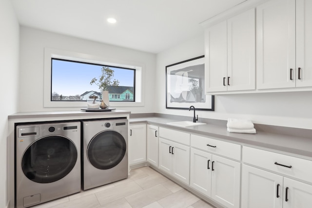10320 Peony Ln N, Maple Grove, MN 55311 - clothes washing area with washing machine and clothes dryer, cabinet space, recessed lighting, and light tile patterned floors