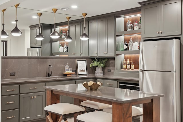 10320 Peony Ln N, Maple Grove, MN 55311 - indoor bar with freestanding refrigerator, tasteful backsplash, and hanging light fixtures