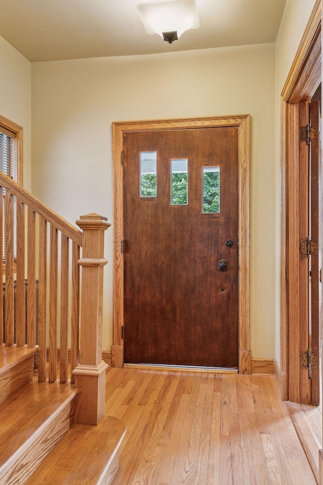 518 32nd St, Minneapolis, MN 55408 - entryway featuring wood finished floors and stairs
