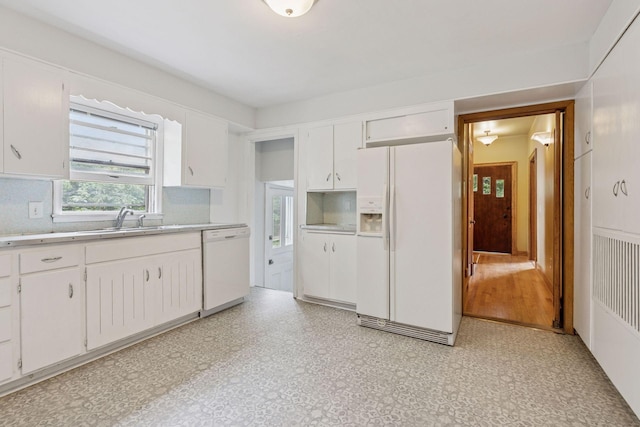 518 32nd St, Minneapolis, MN 55408 - kitchen featuring white appliances, light countertops, white cabinetry, and tasteful backsplash