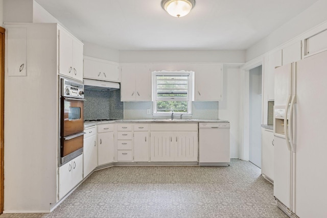 518 32nd St, Minneapolis, MN 55408 - kitchen with white appliances, a warming drawer, backsplash, ventilation hood, and light countertops